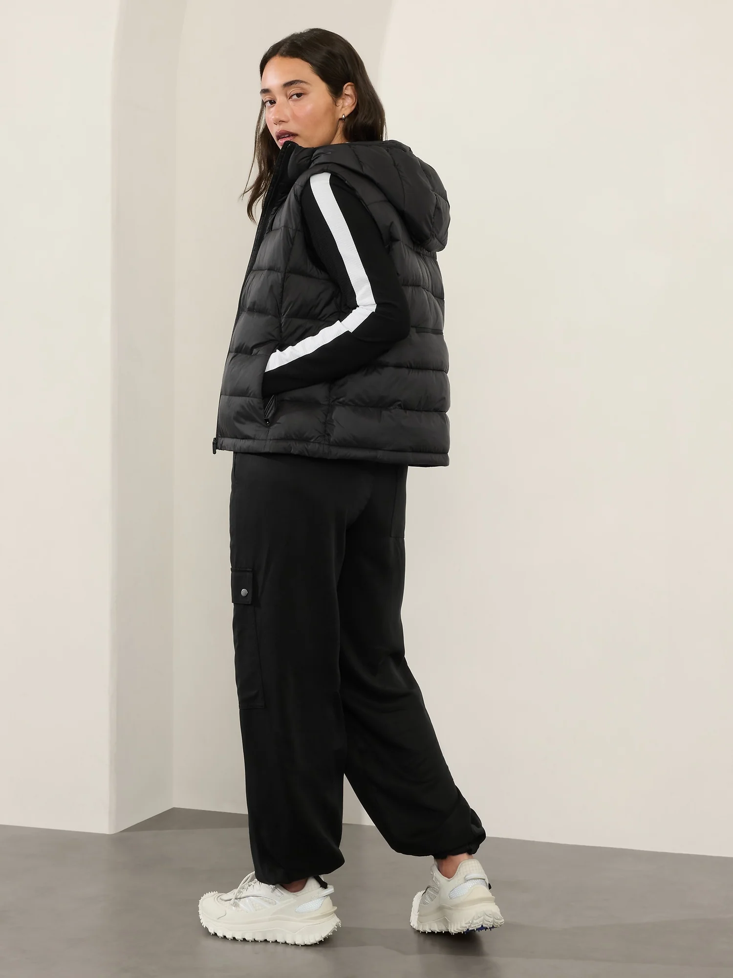 Puffer Vest and Black Sweatpants